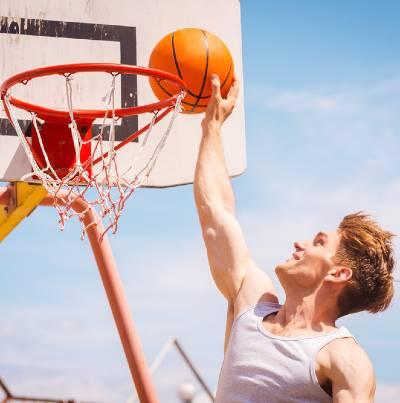 Photo of basketball slam dunk